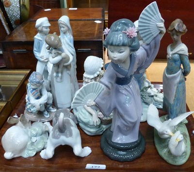 Lot 477 - A group of eleven Lladro figures including a girl with geese, flower girl etc