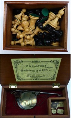 Lot 490 - A Staunton boxwood and ebonised chess set in a mahogany box; and a boxed set of Avery Scales