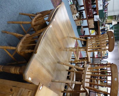 Lot 1008 - An extending dining table and six chairs