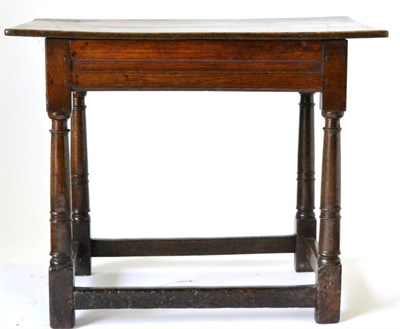 Lot 868 - A 17th Century English Joined Oak Side Table, the plank top above a moulded frieze, raised on...