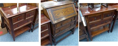 Lot 1022 - A pair of bedside chests of drawers together with an oak bureau