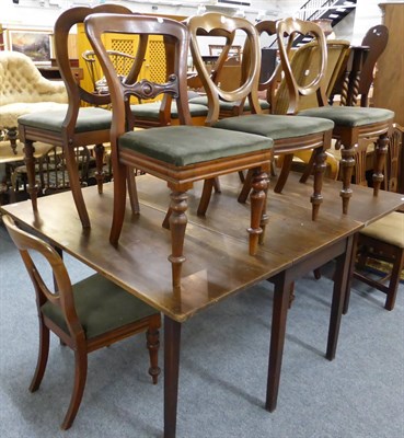 Lot 1029 - A 19th century drop leaf table together with eight Victorian balloon back dining chairs (a...