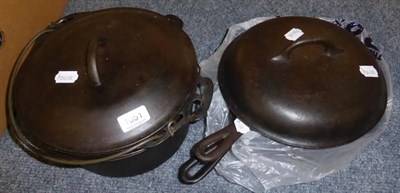 Lot 1051 - Two Grisewold 'Erie' ovens, cornbread skillet and large Wagner pan (American) - USA History items