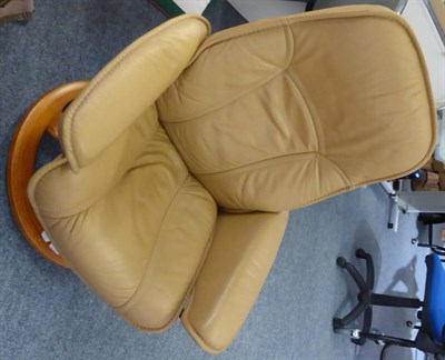 Lot 1068 - A Stressless armchair in tan leather