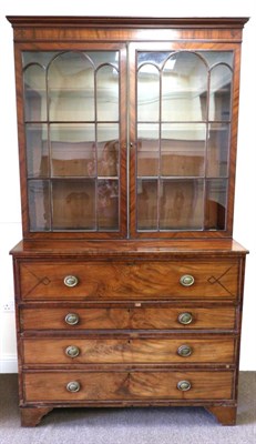 Lot 879 - A Regency Mahogany and Ebony Strung Secretaire Bookcase, early 19th century, with moulded...