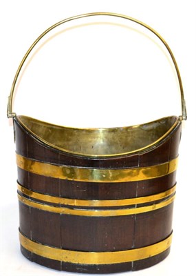 Lot 884 - A George III Mahogany and Brass Bound Oval Oyster Bucket, late 18th century, of staved...