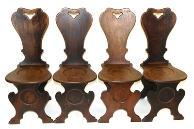 Lot 888 - A Set of Four George III Mahogany Hall Chairs, late 18th century, each with shaped back...