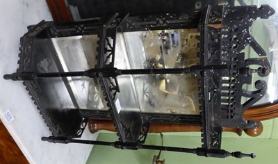 Lot 1212 - An Edwardian ebonised wall mounted mirror/shelves