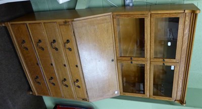 Lot 1219 - A two section glazed oak Minty bookcase and a light oak bureau