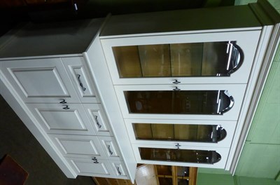 Lot 1220 - A modern display cabinet with cupboard base