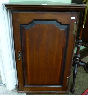 Lot 1228 - An oak corner cupboard