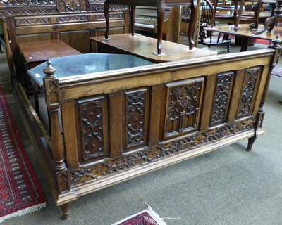 Lot 1230 - A carved oak double bed