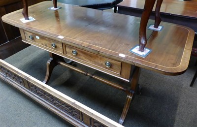 Lot 1236 - A Georgian style mahogany sofa table with two frieze drawers