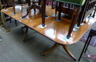 Lot 1239 - A reproduction mahogany twin pedestal dining table