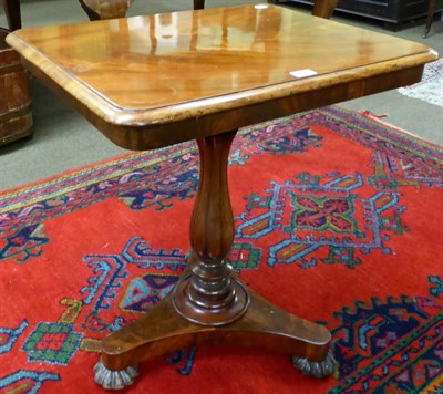 Lot 1262 - A 19th century mahogany tilt top tripod table, the moulded top over a gadrooned baluster...