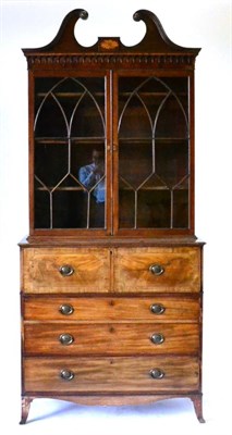 Lot 895 - A George III Mahogany Secretaire Bookcase, late 18th century, the swan neck pediment inlaid...