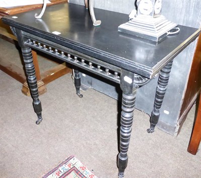 Lot 1267 - An ebonised card table