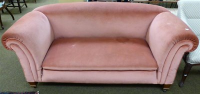 Lot 1285 - A double drop end settee upholstered in salmon fabric