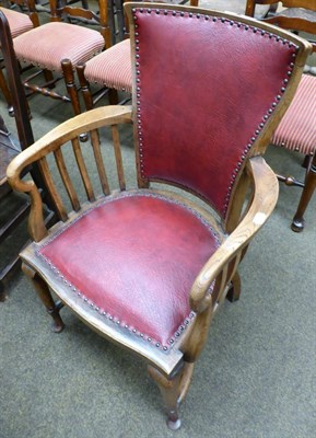 Lot 1293 - An oak library chair