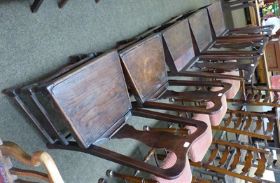 Lot 1294 - A group of five 18th/19th century oak plank seated chairs, three with yoke crest rails and each...