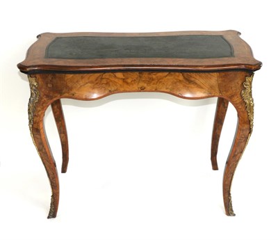 Lot 904 - A Victorian Figured Walnut and Tulipwood Banded Foldover Card Table, circa 1870, of serpentine...