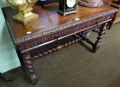 Lot 1342 - Carved oak and barley twist two drawer table