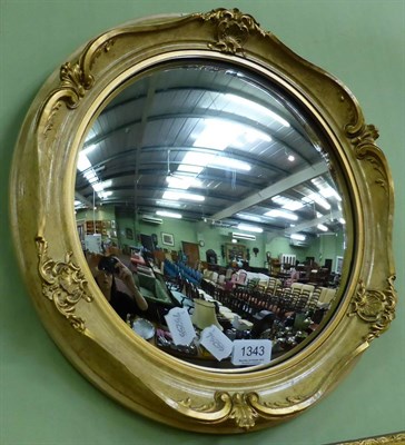 Lot 1343 - A gilt framed convex wall mirror