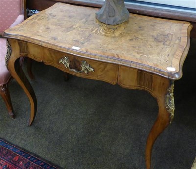 Lot 1346 - A Victorian figured walnut and floral marquetry writing desk, late 19th century, in Louis XV style