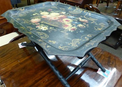 Lot 1352 - A 19th century toleware table on stand with floral decoration