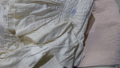 Lot 1373 - Pink and cream cotton reversible single quilt, 135cm by 230cm; another in white, with flower...