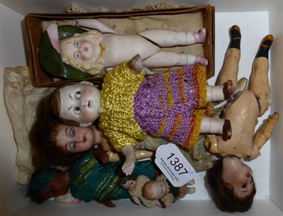 Lot 1387 - Bisque socket googly eyed doll with moulded hair and jointed body, 16cm; bisque jointed doll...