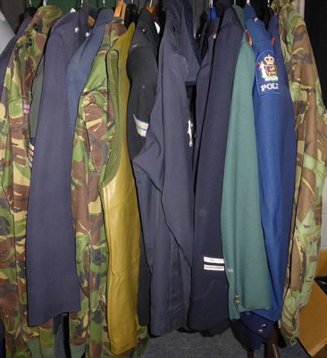 Lot 1405 - Sixteen military and police jackets etc