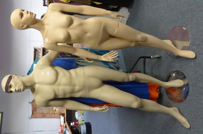 Lot 1411 - * Two modern male and female mannequins on circular stands