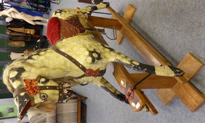 Lot 1429 - A 19th century dapple grey rocking horse on treadle base