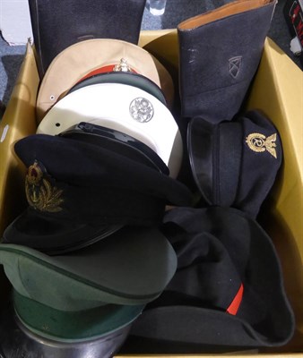 Lot 1431 - A quantity of military and other hats and a pair of military boots