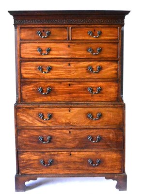 Lot 918 - A George III Mahogany Chest on Chest, late 18th century, with blind fret carved frieze above...