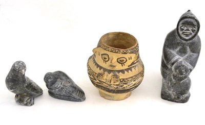 Lot 31 - Inuit and Columbian work: Three carvings and a pot