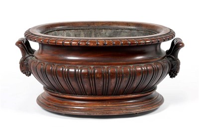 Lot 921 - A Carved Mahogany Oval Wine Cistern, early 19th century, with lead lined interior and gadrooned...