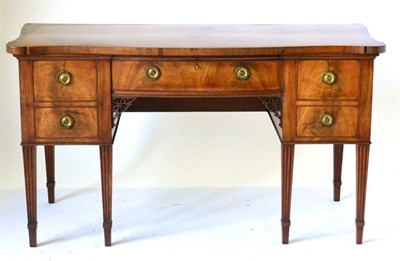 Lot 923 - A George III Mahogany and Crossbanded Serpentine Shaped Sideboard, circa 1800, the parquetry...