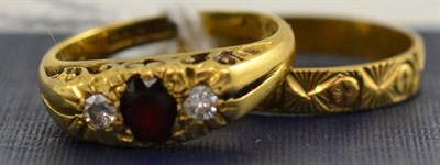 Lot 64 - 18ct gold garnet and diamond set ring and an 18ct gold band ring