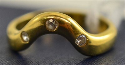 Lot 65 - An 18ct gold diamond set shaped band ring