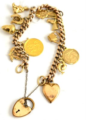 Lot 82 - A charm bracelet hung with charms (mainly 9ct gold) including a soldered 1905 half sovereign