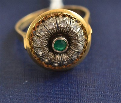 Lot 92 - An emerald and diamond cluster ring stamped 'K18'