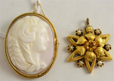 Lot 103 - A cameo brooch in a rope twist decorated frame, stamped ";9"; and a seed pearl set pendant (a.f.)