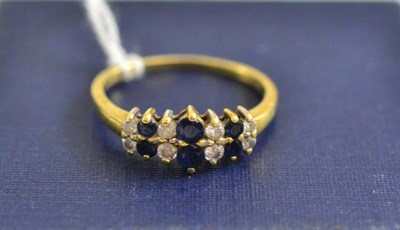 Lot 108 - An 18ct gold sapphire and diamond ring