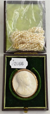 Lot 110 - A cameo brooch and a five strand pearl necklace