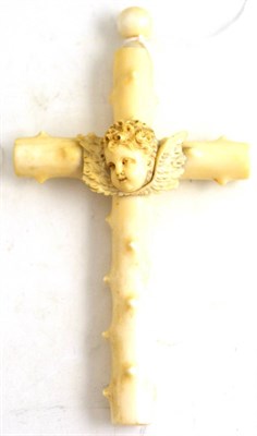 Lot 137 - A late 19th/early 20th century ivory cross mounted with cherub