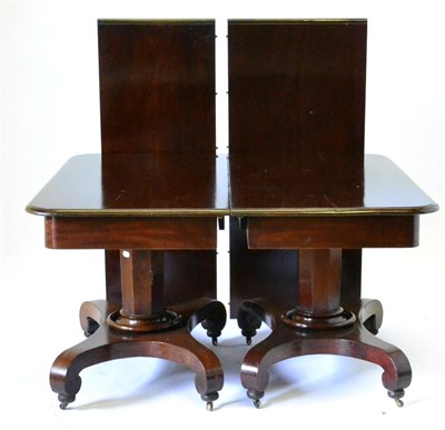 Lot 936 - A William IV Mahogany Twin-Pedestal Extending Dining Table, 2nd quarter 19th century, with four...