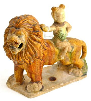 Lot 201 - A Tang style lion and figure