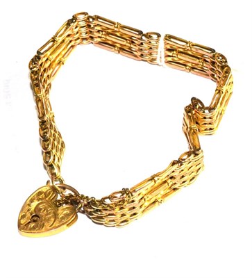 Lot 292 - A gate bracelet, with engraved padlock